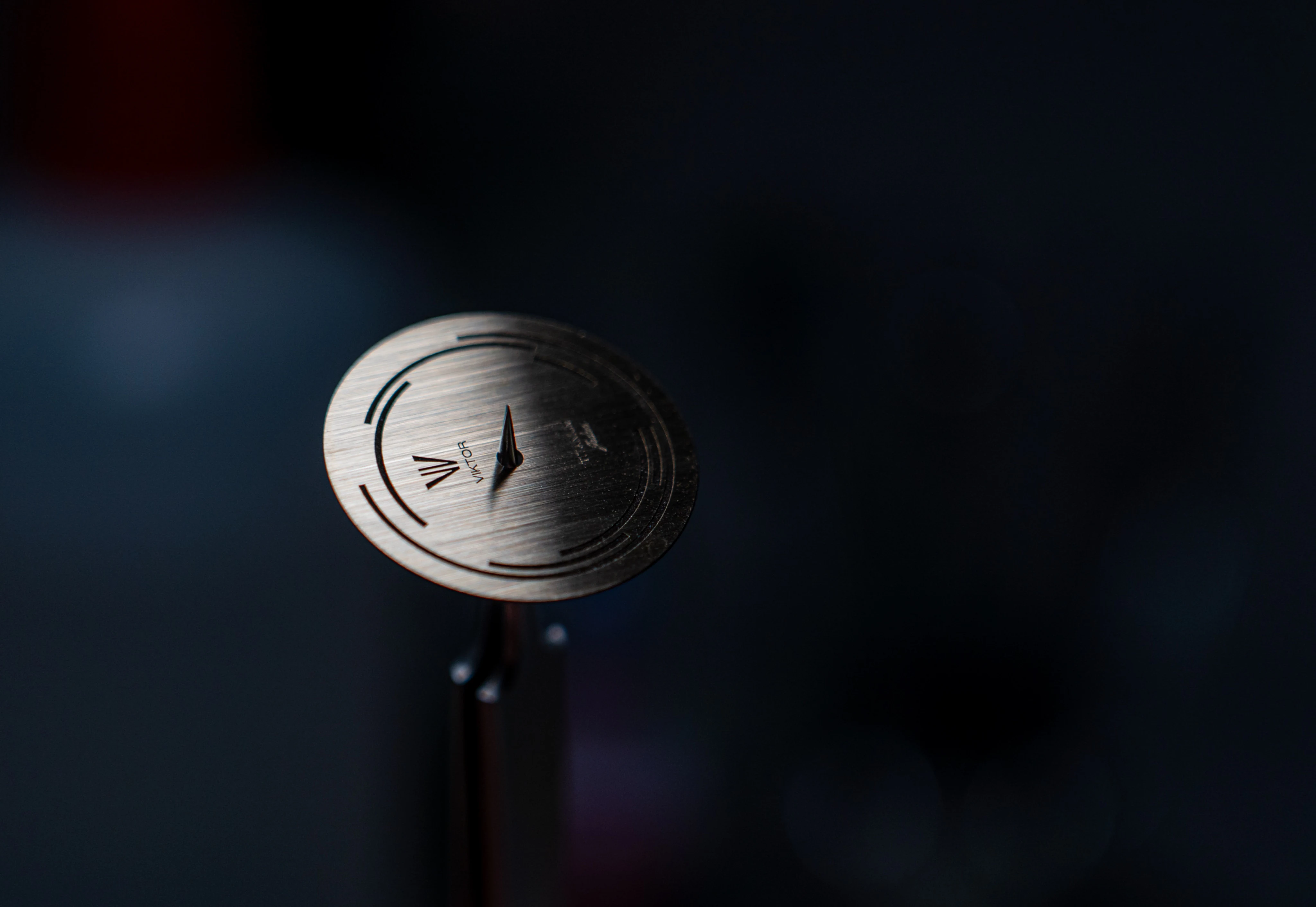 Model Jedan dial detail in low light